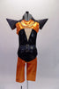 Black camisole top has a nude mesh insert with crystal accent and sequined belt. An orange metallic and sequined short shrug sits over top with pointy cone shoulders and chains. Matching orange knee-length pants accompany the top. Comes with a unique copper and black mask. Front