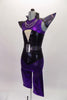 Black camisole top has a nude mesh insert with crystal accent and sequined belt. A purple metallic and sequined short shrug sits over top with pointy cone shoulders and chains. Matching purple knee-length pants accompany the top. Comes with a unique purple and black mask.  Side