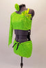 This two-piece neon lime green costume comes with an angled, single shoulder half top has a jewelled bow accent at the left bust below the shoulder strap. The back is comprised entirely of a series of crossing 1” straps. The bottom is sequined shorts with front knot tie accent. Comes with matching hair accessory. Left side