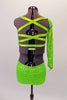 This two-piece neon lime green costume comes with an angled, single shoulder half top has a jewelled bow accent at the left bust below the shoulder strap. The back is comprised entirely of a series of crossing 1” straps. The bottom is sequined shorts with front knot tie accent. Comes with matching hair accessory. Back