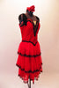 Saloon girl themed, knee-length dress has layers of red, lace-trimmed sheer skirt attached to a red velvet bodice. Black fringe adorns the shoulders and extends along the back Comes with crystalled rose hair accessory. Side