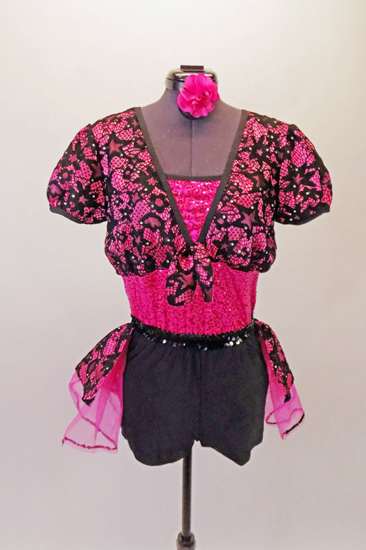 Short unitard has a fuchsia sequined bodice and sold black short with a black sequined waistband. An attached black lace and fuchsia bustle skirt compliments the black lace and fuchsia shrug that ties at front. Comes with a fuchsia floral hair accessory. Front