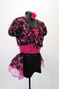 Short unitard has a fuchsia sequined bodice and sold black short with a black sequined waistband. An attached black lace and fuchsia bustle skirt compliments the black lace and fuchsia shrug that ties at front. Comes with a fuchsia floral hair accessory. Side