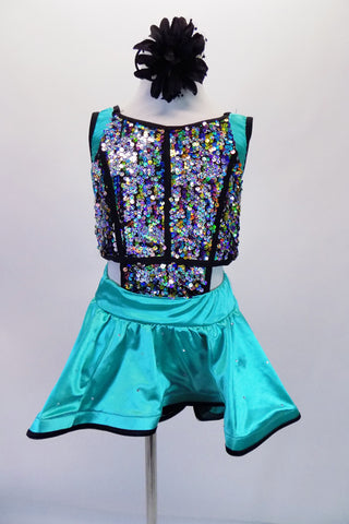 Unique costume has colourful upper composed of sequined panels attached to an aqua short circle skirt with stiffened edging, The back has double cross straps that extend between the shoulder blades. Comes with a floral hair accessory.