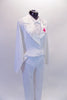 White tie and tails three-piece costume is comprised if a leotard with faux collar, bow tie and pearl buttons. it is accompanied by a pair of straight leg, white elastic waist pants and a white satin lapelled tailcoat with pink floral lapel accent. Side