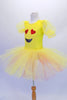 Adorable yellow pleated ballet dress has sheer pouffe sleeves and a large emoji-style happy face on the torso with a crystal-edged neckline. The tutu skirt is yellow with a layer of pale pink beneath. Comes with large yellow hair bow accessory.  Side
