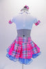 School uniform themed  2-piece costume comes with a wide pleated pink & blue tartan skirt with a wide waistband & bright pink inner pleats. The matching white half top has collar, buttons & cap sleeves with AB crystals and tartan accents. Comes with a large tartan bow hair accessory & purple gauntlets. Back