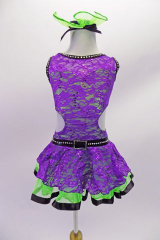 Purple lace costume has a lime green base has deep U-back. The black edging & belt are lined with crystals to make the costume pop. The cut-out side extends to an open back. The is a lime green crinoline skirt under the purple lace with black satin ribbon edge. Comes with a hair accessory. Front