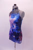 Halter style leotard with high collar and keyhole back has a galactic print with the cosmos in shades of blues and purples. Left side