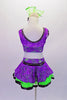 Purple lace costume has a lime green base has deep U-back. The black edging & belt are lined with crystals to make the costume pop. The cut-out side extends to an open back. The is a lime green crinoline skirt under the purple lace with black satin ribbon edge. Comes with a hair accessory. Back
