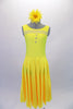 Tank style, yellow calf-length dress has a deep u-back and lovely flowing circle skirt with attached brief. A double row of crystals bands accent the front bustline and compliment the three crystal buttons. Comes with a yellow gerbera hair accessory. Front