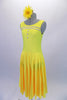 Tank style, yellow calf-length dress has a deep u-back and lovely flowing circle skirt with attached brief. A double row of crystals bands accent the front bustline and compliment the three crystal buttons. Comes with a yellow gerbera hair accessory. Side