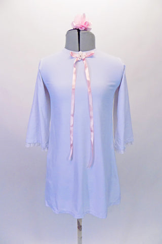 Nightgown themed costume is a white ¾ bell-sleeved tunic dress with lace trim and a pink ribbon accent extending from the front below the neck. Comes with a pink hair accessory. Front