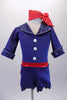 Sweet royal blue short jumpsuit has zip-up back, cuffed ¾ sleeves and lapelled collar accented with crystals. Three large white buttons accent the front of the torso and a crystalled red belt-like waistband gives the costume a pop of colour. Comes with a matching red and white polka dot neck scarf. Front