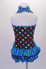 Cute colourful, short halter unitard has rainbow polka dots on a black base. Green and blue stripe triple ruffle creates an open front bustle and matches the crystalled banding and large bows at bust and back of the neck. Comes with a hair accessory. Back