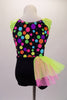 Bright and cheery short tank style unitard has a black bottom and a top with colourful bubble pattern. The bust is gathered and pinched with a bright pink band and the shoulders are neon green. The right hip is adorned with a neon green and pink tulle side bustle. Comes with a bubble hair accessory. Back