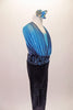 Full unitard has a blue metallic halter bra top beneath a shawled halter with black velvet bottom. The gathered shawls are attached at the centre of the waistband of the black velvet leggings and come up over the bust on either side clipping at the back of the neck. Comes with a blue floral hair accessory.Side