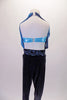 Full unitard has a blue metallic halter bra top beneath a shawled halter with black velvet bottom. The gathered shawls are attached at the centre of the waistband of the black velvet leggings and come up over the bust on either side clipping at the back of the neck. Comes with a blue floral hair accessory. Back