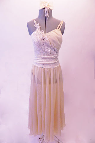 Lovely ivory/cream coloured dress has a long chiffon skirt attached to a sequined-lace and chiffon camisole style leotard. Sequined bridal applique cascades across the front of the torso. Comes with matching hair accessory. Front