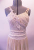 Lovely ivory/cream coloured dress has a long chiffon skirt attached to a sequined-lace and chiffon camisole style leotard. Sequined bridal applique cascades across the front of the torso. Comes with matching hair accessory. Front zoomed