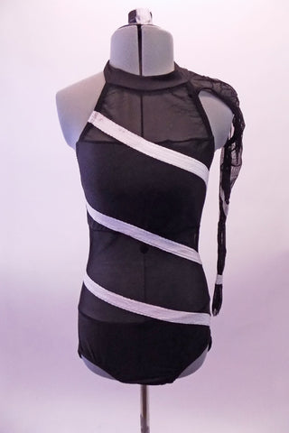Black halter leotard has open back, solid bust and bottom while the rest is black sheer mesh.  White angled stripes cross the torso both front and back. The left sheer sleeve is attached to the collar at the left shoulder. Front