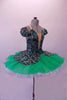 Gorgeous tutu has a dark velvet base with silver & emerald glitter leaf swirl pattern. The bodice has a low plunge front bust area. The low open back has cross straps. The peplum of the skirt overlay sits over layers of sheer emerald poly-chiffon. The crip tulle pull-on tutu is hand stitched but not pleated or hooped. Side