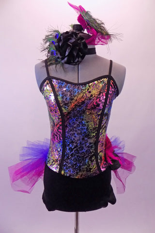 Short unitard has a black bottom & colourful peacock feather print bodice. The black princess cut lines on the bodice extend into straps. Along the hip is a blue & fuchsia ruffled tulle bustle skirt, feather hip accent as well as a  floral choker collar with peacock feathers. Comes with peacock feather hair accessory. Front