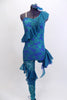Custom acro unitard of teal lace on an electric blue base has one leg & one shoulder and ruffles across bodice. Right leg is sheer lace with soft ruffles. Comes with custom hair piece. Front