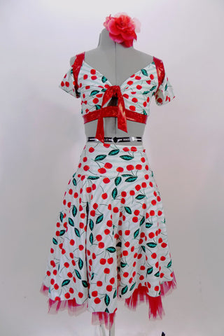Costume with large cherries on a white base with pale aqua stripes. Comes with off-shoulder half-top with red accent trim, cherry print shorts & crinoline lined circle skirt. Has matching hair accessory. Front