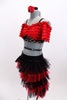 Latin flare costume has red ruffled off shoulder half-top with black lace band. Skirt has layers of black & red tulle. Has attached panty& matching hair accessory. Side