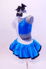 Leotard has one white high neck open side joined to a bright turquoise half-top.There is a skirt,  black glasses,  hair bow & crystal covered “Jane” name tag.  Side