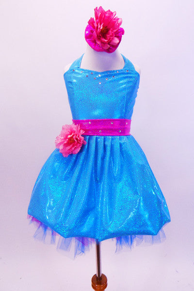 Sparkle- lycra turquoise halter dress has bright pink crystal covered waistband with pink flower and matching bottoms. Comes with matching pink floral hair accessory. Front