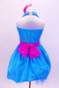 Sparkle- lycra turquoise halter dress has bright pink crystal covered waistband with pink flower and matching bottoms. Comes with matching pink floral hair accessory. Back