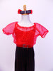 Pantsuit has red pinstripe black pants attached to red dotted organza blouse with red camisole underlay and a crystal buckle. Comes with hair accessory. Front Zoom