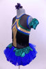 Tank leotard dress has blue, green & gold piping, black fringe from  bust to back & a blue tutu skirt with green scales accents. Has gauntlet and hair accessory. Side