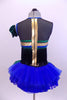 Tank leotard dress has blue, green & gold piping, black fringe from  bust to back & a blue tutu skirt with green scales accents. Has gauntlet and hair accessory. Back