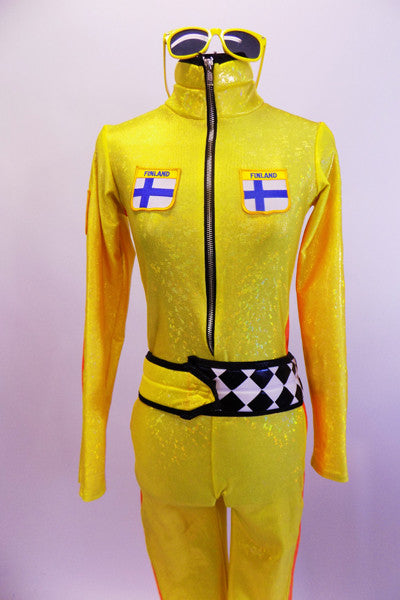 Yellow zip front full unitard has Finish emblems on front bodice. Sides have bright orange racing stripes & belt is black/white checkered. Comes with sunglasses. Front