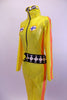 Yellow zip front full unitard has Finish emblems on front bodice. Sides have bright orange racing stripes & belt is black/white checkered. Comes with sunglasses. Side