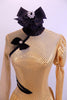 Gold long sleeved dress had one pouf & one sheer gold mesh sleeve & shoulder. Oriental style collar & piping. Has large black bow on back & black hair bow. Front Zoom