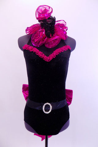 Black high neck halter leotard has collar of hot pink sequined roses. There is a large pink bow on behind. Has longs black gloves and matching hair accessory. Front
