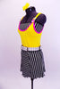 Three piece costume yellow leotard with pink piping and white shoulder buckles. The skirt is black and white striped alternating panels with a white belt and matching striped  bandeau top.  Comes with bright yellow hair accessory. Side