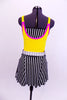 Three piece costume yellow leotard with pink piping and white shoulder buckles. The skirt is black and white striped alternating panels with a white belt and matching striped  bandeau top.  Comes with bright yellow hair accessory. 