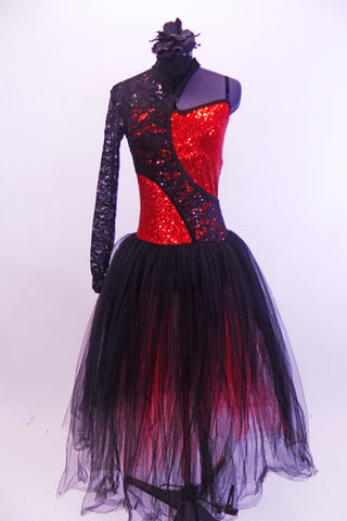 Red sequined spaghetti strapped  leotard has a black bottom. A black sequined lace, one shoulder shrug, attaches around high neck collar and swoops  across to opposite hip at both front and back. Gives swirl illusion affect. The skirt is several long layers of soft black and red tulle. Comes with black floral hair accessory. Front