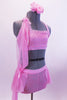 Pink sparkle fabric half-top with ruffle accent has matching shorts with light mesh skirt. The two pieces are attached along the right side with pink sheer mesh and ribbons. Waistband and bodice are accented with crystals. Comes with matching hair accessory. Side