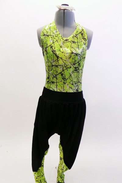 Neon green, open backed leotard with black splatter pattern has black hip-hop harem pants with matching green pattern on lower leg.  Comes with hair accessory. Front