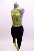 Neon green, open backed leotard with black splatter pattern has black hip-hop harem pants with matching green pattern on lower leg.  Comes with hair accessory. Side