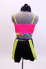 Bright neon pink half top comes with black shorts, sequined black tie/collar accessory, bright yellow hanging suspenders and a neon green hat. Back
