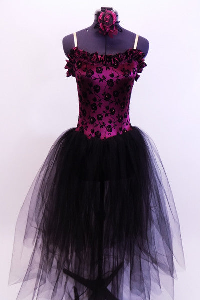 Camisole style satin leotard ballet dress has velvet rose embossed bodice with Swarovski crystals and a satin ruffle along neckline. The attacked skirt is multiple layers of long black soft tulle for a pretty flow. Comes with matching rose hair accessory. Front