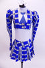 Three piece costume comes with white halter leotard with painted tie, blue-white-black tartan pleated skirt and pouf-sleeved blazer. Comes with white hair bow. Front