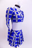Three piece costume comes with white halter leotard with painted tie, blue-white-black tartan pleated skirt and pouf-sleeved blazer. Comes with white hair bow. Side